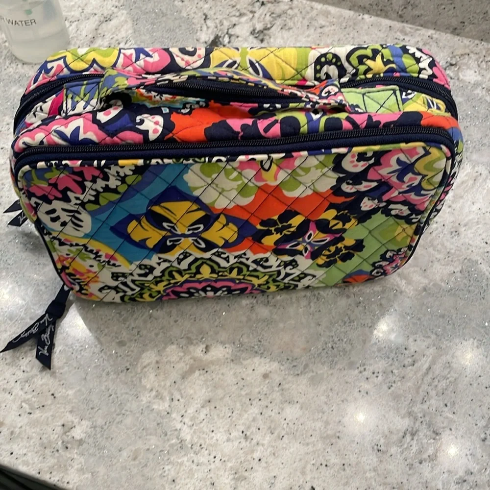 Vera Bradley travel toiletry bag with brush compartments.